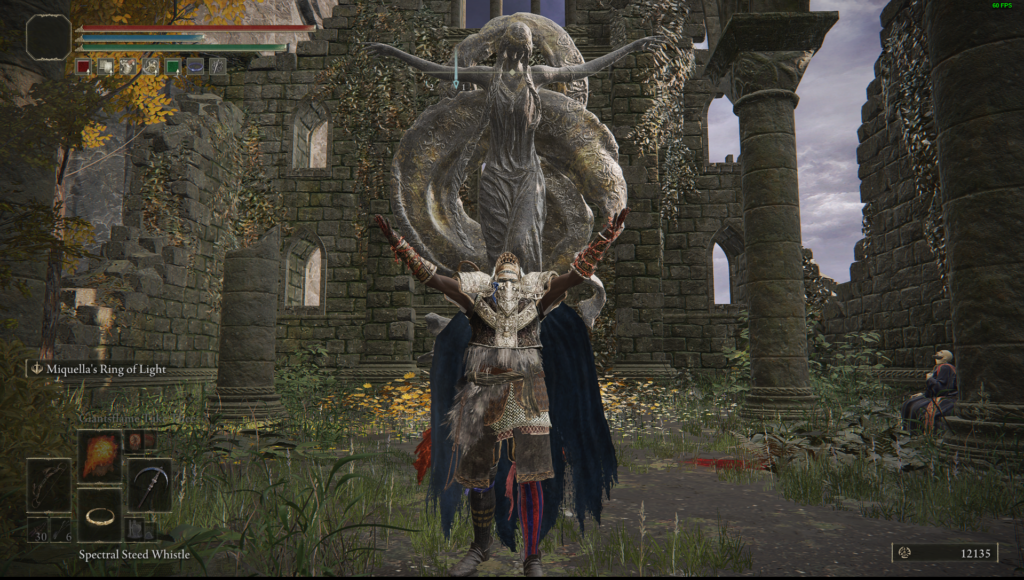 A character spreads their arms high and wide in front of a statue in the same pose.