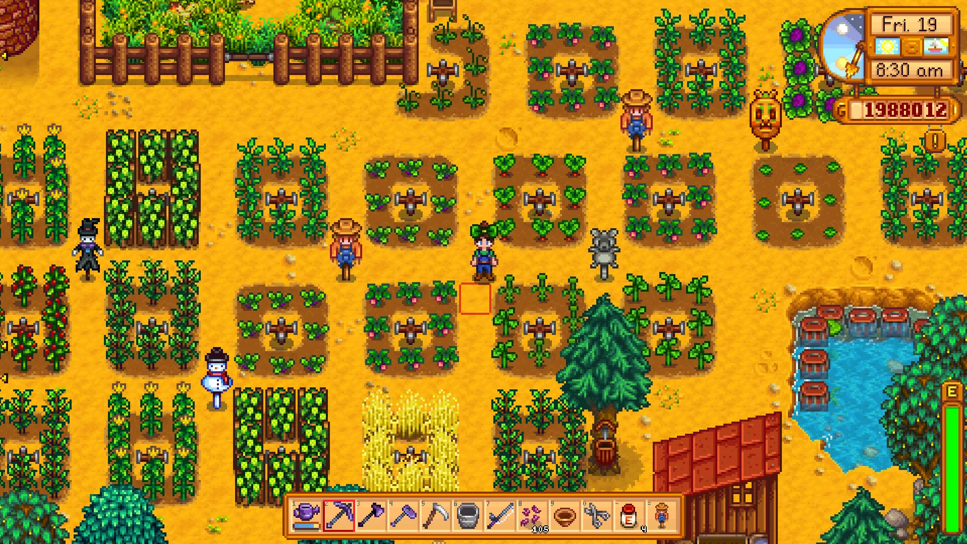 A Stardew Valley player stands in a field full of crops and scarecrows, with the game's date and time showing in the top right hand corner.