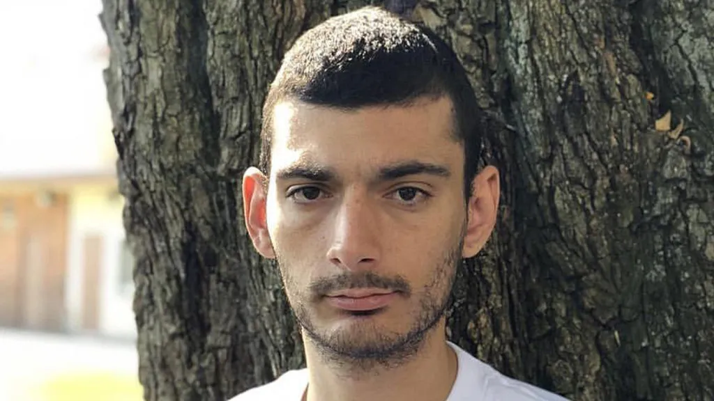 Ice Poseidon standing infant of a tree.