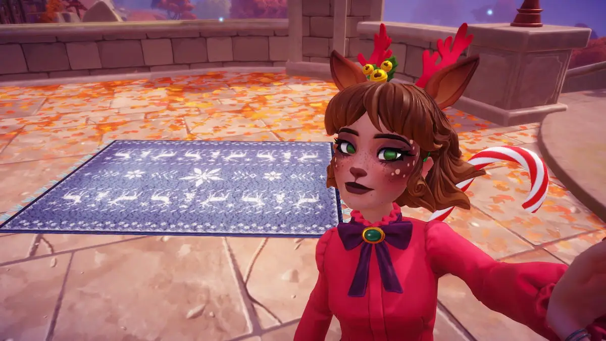 A player with reindeer antlers and ears taking a picture with a blue winter rug in Disney Dreamlight Valley.