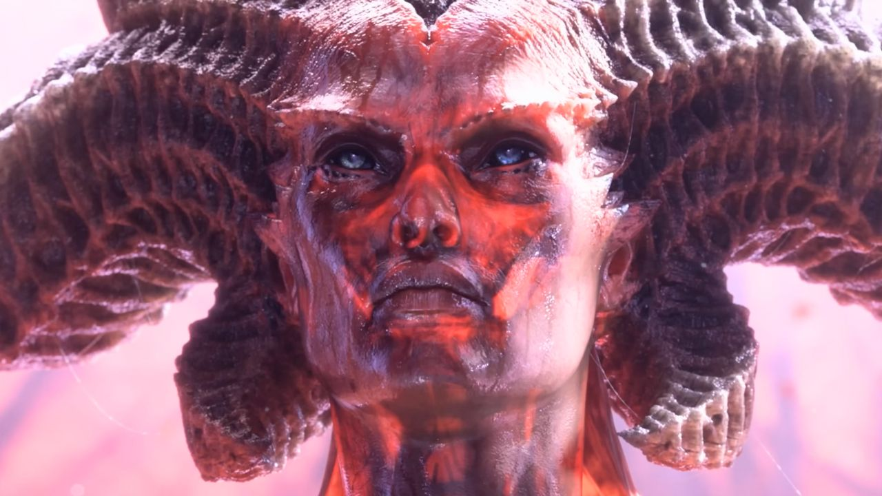 The face of a horned woman with very red skin and different colored eyes in Diablo 4