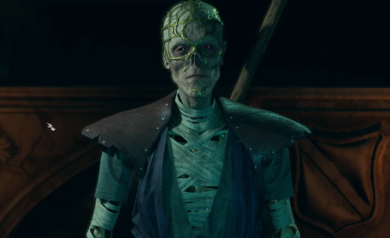 A screenshot of Withers, the undead Baldur's Gate 3 companion with an intricate gold lattice mask on his head and decaying face.