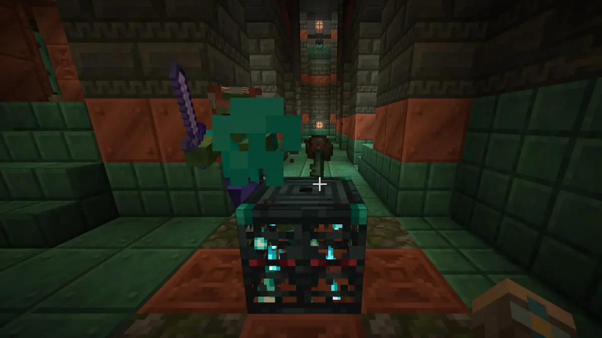 An Ominous Trial Key on top of a spawner in Minecraft.