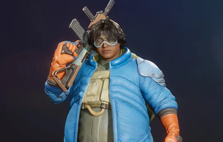 Daw Concord, wearing a puffly blue coat, orange gloves, and goggles.