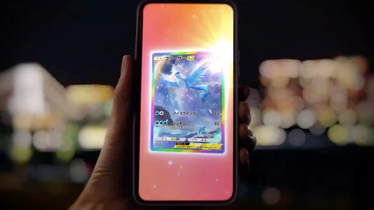 Someone holding a phone with an Articuno card in TCG Pocket.