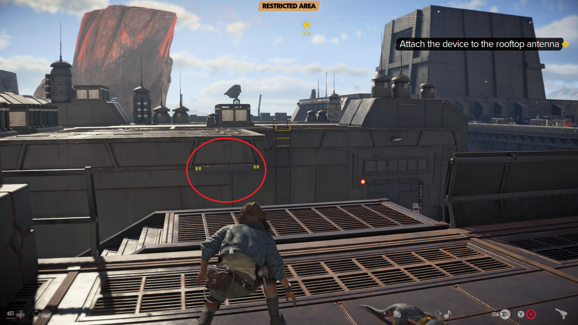 A building with a small ledge marked in the middle of an Imperial base, with plenty of antennae in the background.