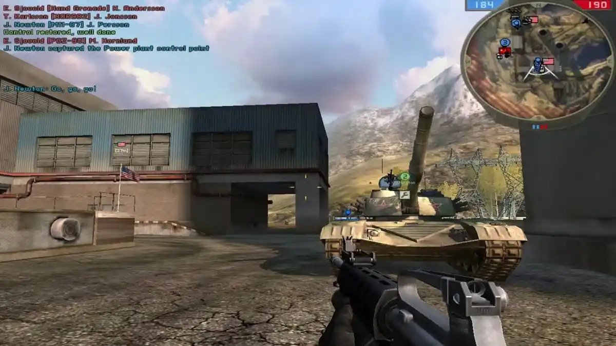 Player character aiming at a building with an approaching tank in a mountainous land in Battlefield 2