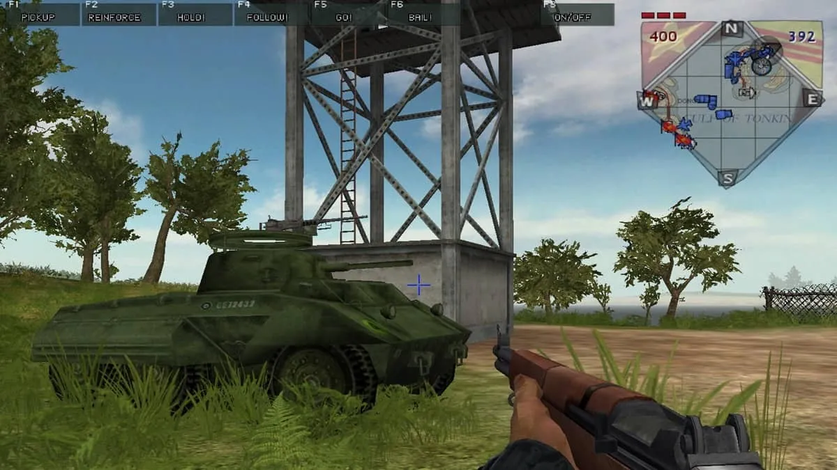 Player character aiming a gun at a tank next to a tower in Battlefield Vietnam