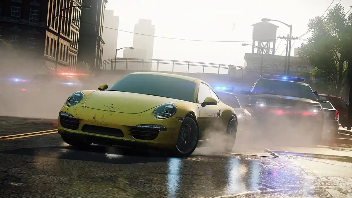 Yellow sports car being pursued by police cars on the street with buildings in the background