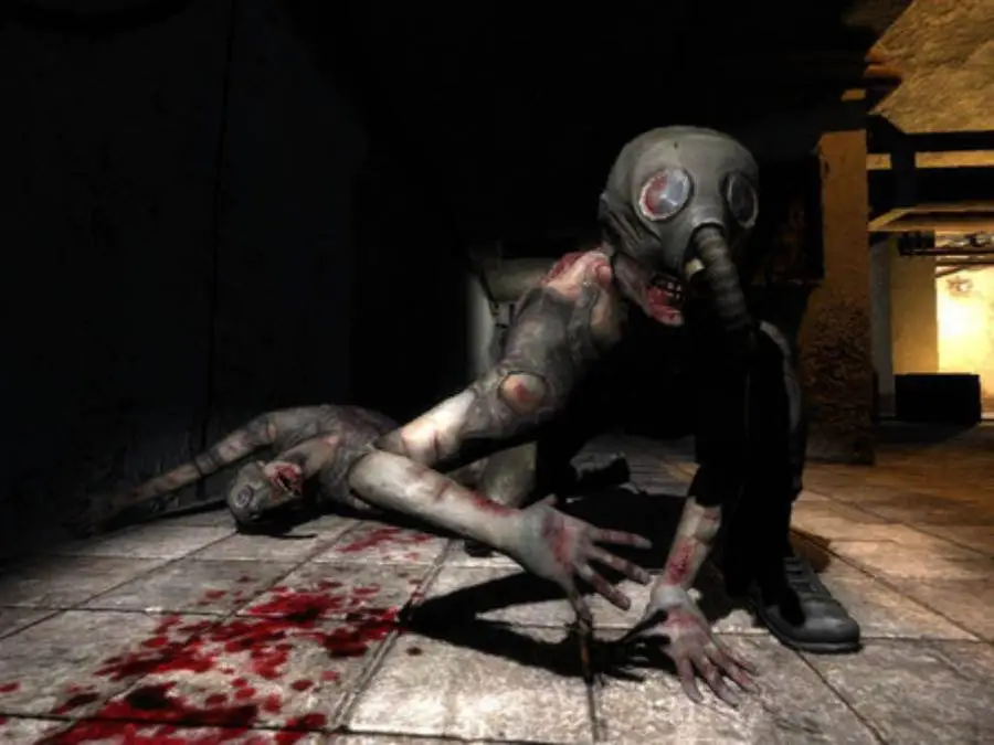 A shot of a corpse beside a crouched down character wearing a gas mask