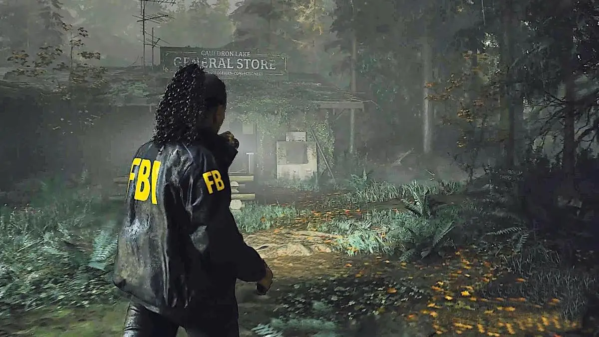 An FBI agent walking toward a run-down store in the middle of the forest