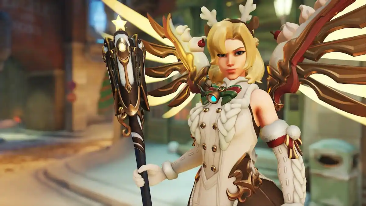 Mercy holds her staff dressed in a winter costume with reindeer antlers.