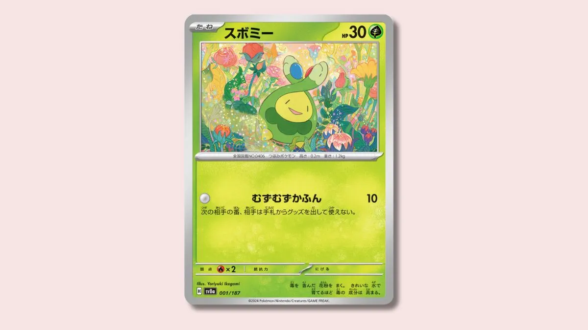 Budew Pokémon card on a pink background.