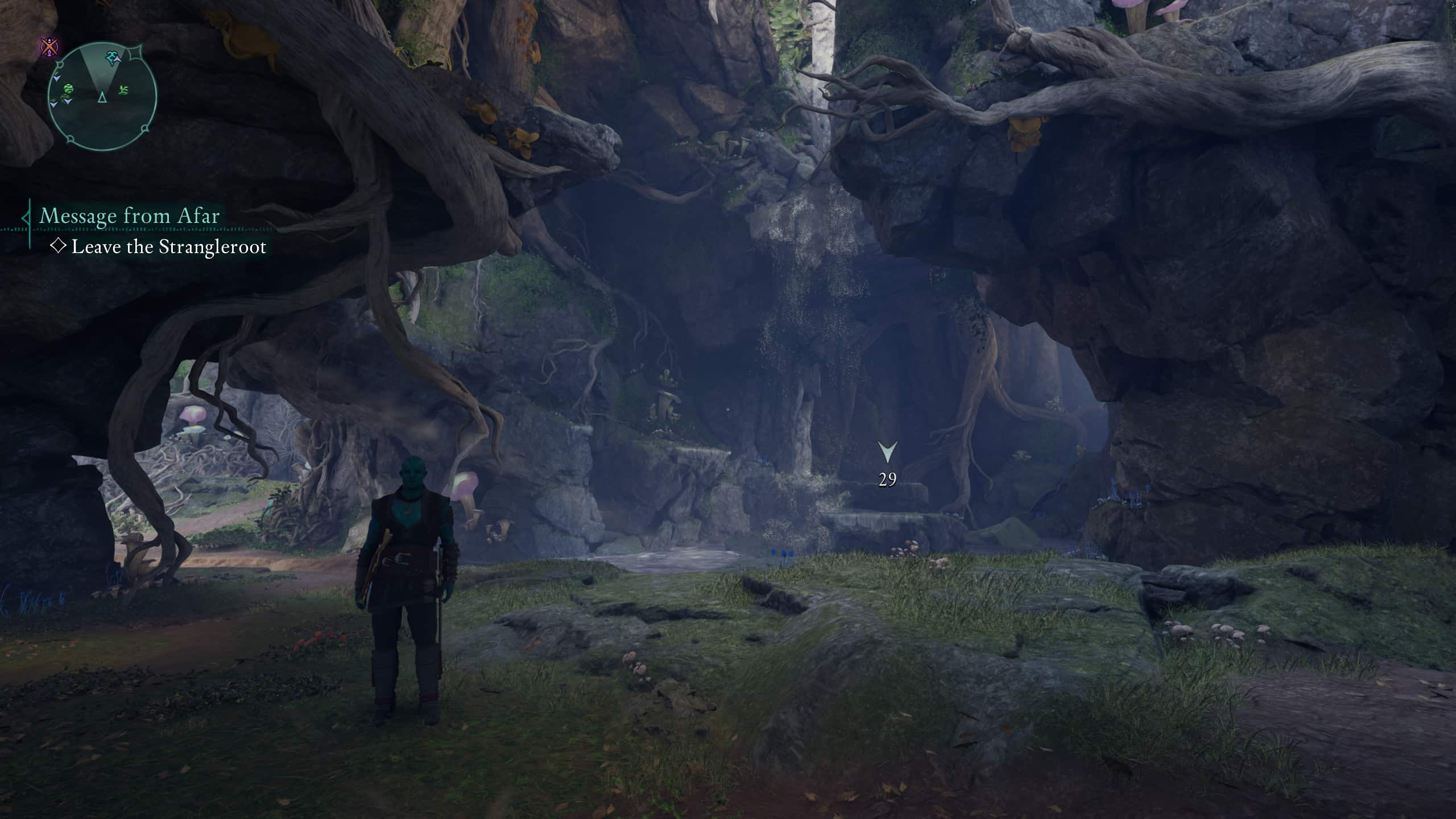 A grove with a waterfall and sprouting grass. A man stands in front of you.