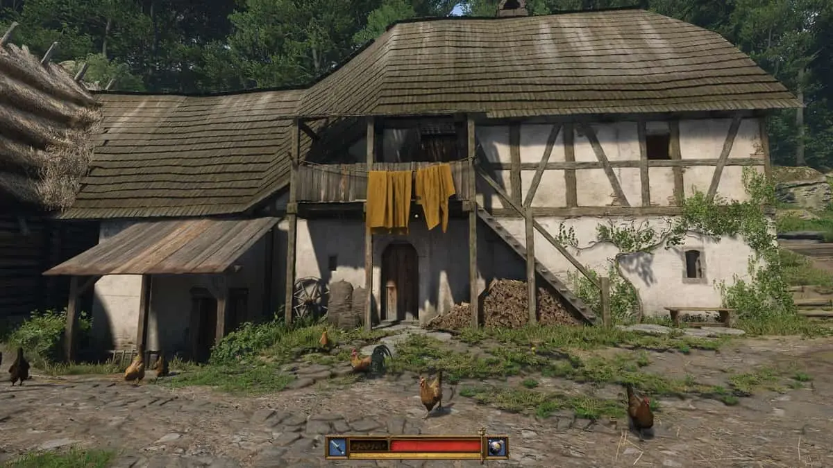 A functioning mill with two storeys on a farm with chicken running around in Kingdom Come Deliverance 2